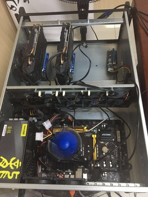 A mining rig being repaired by a technician